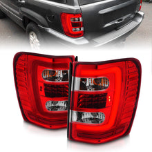 Load image into Gallery viewer, ANZO 1999-2004 Jeep Grand Cherokee LED Tail Lights w/ Light Bar Chrome Housing Red/Clear Lens 311396