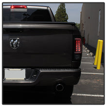 Load image into Gallery viewer, Spyder 09-16 Dodge Ram 1500 Light Bar LED Tail Lights - Black Smoke ALT-YD-DRAM09V2-LED-BSM 5084033